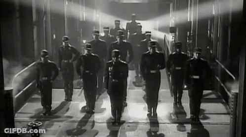 Black And White Photo Of Men In Uniforms GIF