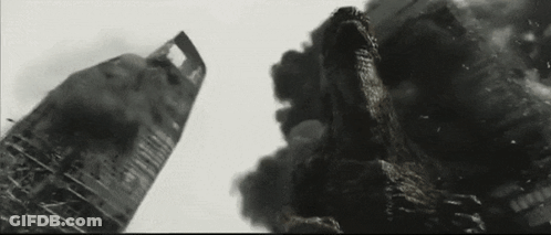 Black And White Photo Of Monster Destroying Building GIF