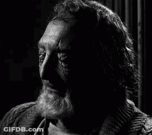 Black And White Photo Of Old Man With Beard And Long Hair GIF