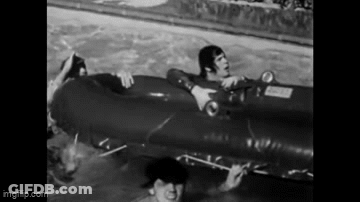 Black And White Photo Of People Carrying Coffin Saying Fuck GIF
