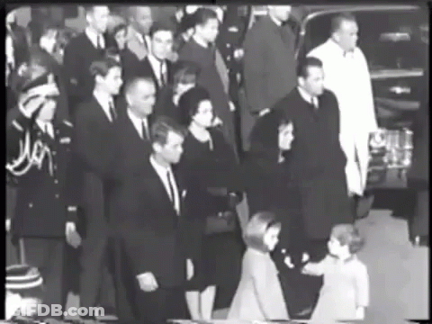 Black And White Photo Of People In Suits GIF