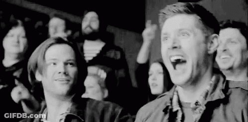 Black And White Photo Of People Sitting In Theater GIF
