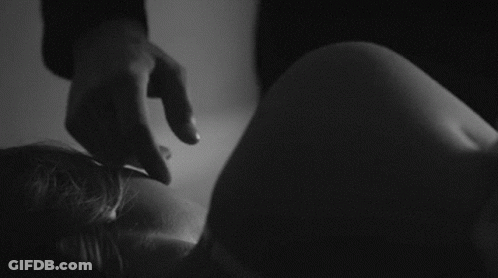 Black And White Photo Of Person Holding Leg GIF