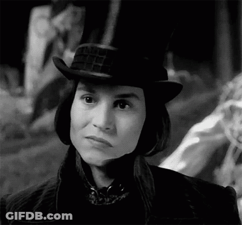 Black And White Photo Of Person In Top Hat And Jacket GIF