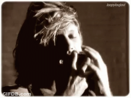 Black And White Photo Of Person Smoking Cigarette GIF