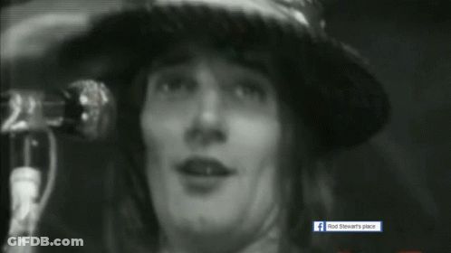 Black And White Photo Of Rod Stewart's Place With Person In Hat GIF