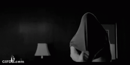 Black And White Photo Of Shirtless Man Standing In Room GIF