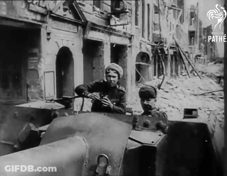 Black And White Photo Of Soldiers In Tank With Pathe Logo GIF