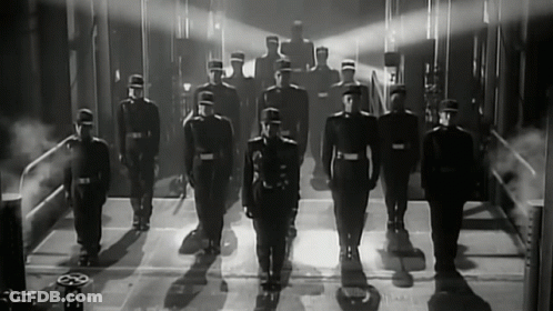 Black And White Photo Of Soldiers Standing In Line GIF