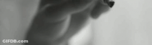 Black And White Photo Of Torso And Legs GIF