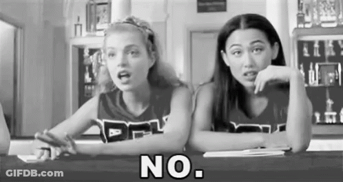 Black And White Photo Of Two Cheerleaders Saying No GIF