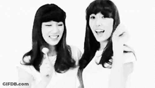 Black And White Photo Of Two Girls Standing Together GIF