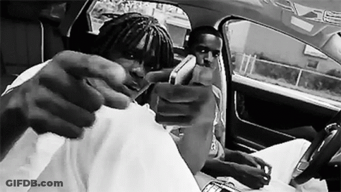 Black And White Photo Of Two Men In A Car GIF