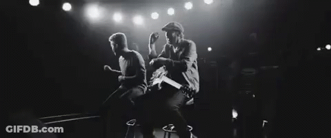 Black And White Photo Of Two Men Playing Guitars GIF