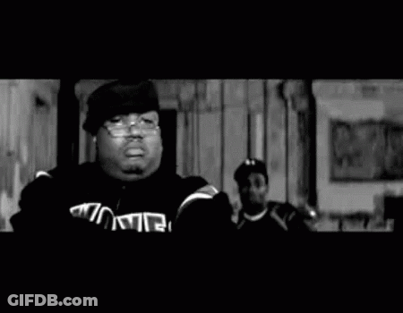 Black And White Photo Of Two Men Standing Together GIF