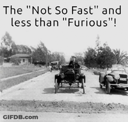 Black And White Photo Of Two Old Cars Saying The Not So Fast And Less Than Furious GIF