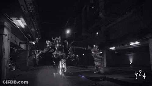Black And White Photo Of Two Robots Fighting Number 626 GIF
