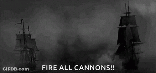 Black And White Photo Of Two Ships Firing Cannons GIF