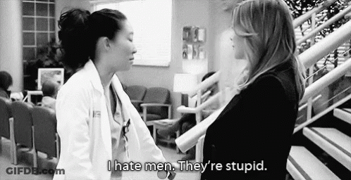 Black And White Photo Of Two Women In Hospital Lobby GIF