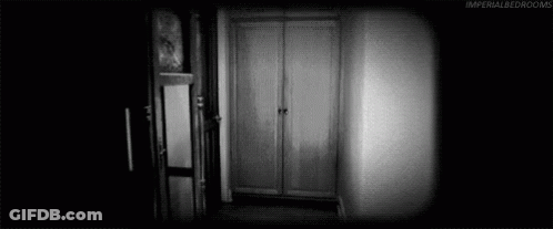 Black And White Photo Of Two Women Standing In Room GIF