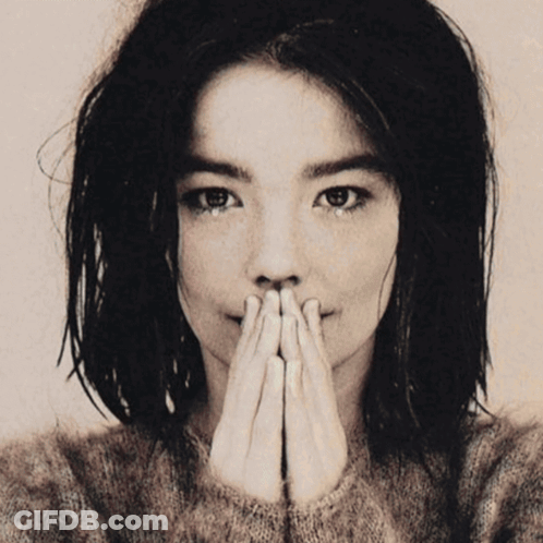 Black And White Photo Of Woman Covering Mouth GIF