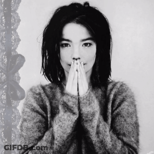 Black And White Photo Of Woman Covering Mouth GIF