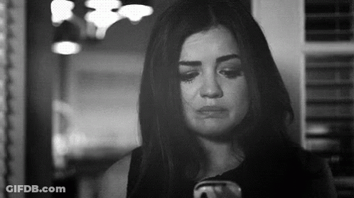 Black And White Photo Of Woman Crying At Cell Phone GIF