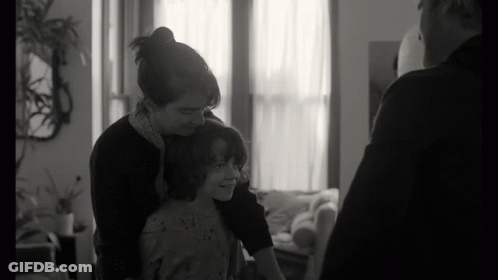 Black And White Photo Of Woman Holding Child GIF