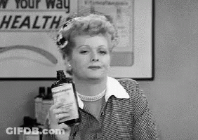 Black And White Photo Of Woman Holding Lotion GIF
