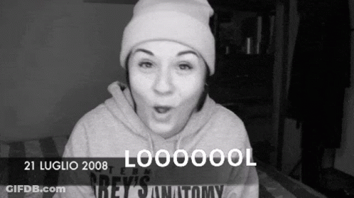 Black And White Photo Of Woman In Beanie And Grey 'S Anatomy Hoodie GIF