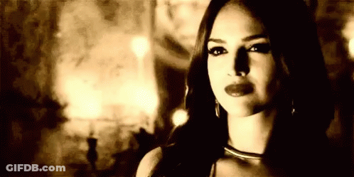 Black And White Photo Of Woman In Dark Room GIF