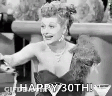 Black And White Photo Of Woman In Dress Holding Martini Saying Happy 30Th GIF
