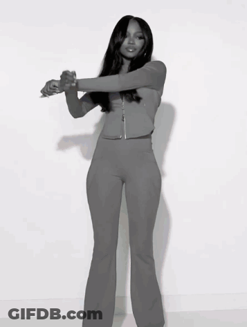 Black And White Photo Of Woman In Gray Outfit GIF