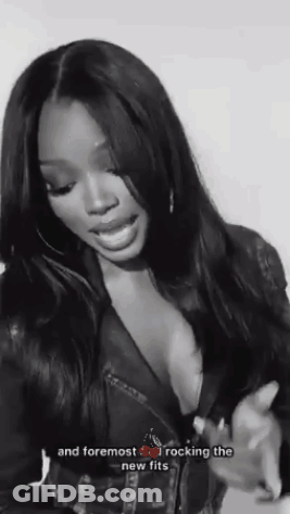 Black And White Photo Of Woman In Plunging Leather Jacket GIF
