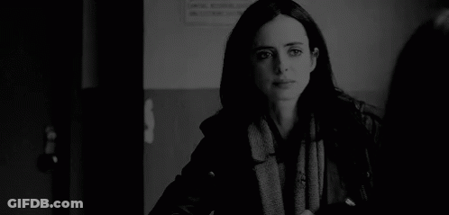 Black And White Photo Of Woman In Scarf And Jacket GIF
