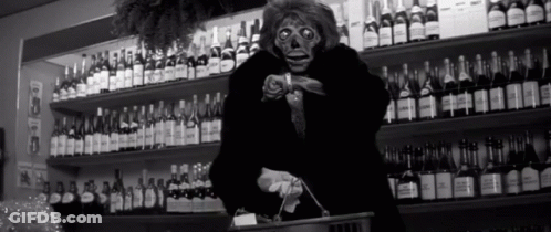 Black And White Photo Of Woman In Store GIF