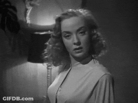 Black And White Photo Of Woman In White Dress GIF