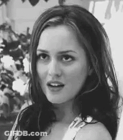 Black And White Photo Of Woman Looking At Camera GIF