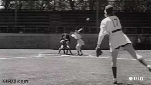 Black And White Photo Of Woman Playing Softball GIF