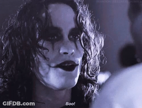 Black And White Photo Of Woman Saying Boo GIF
