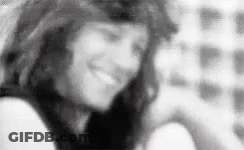 Black And White Photo Of Woman Smiling In Room GIF