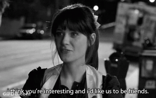 Black And White Photo Of Woman Talking To Man On Sidewalk GIF