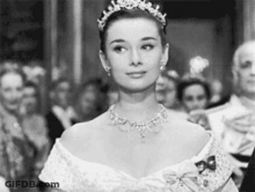 Black And White Photo Of Woman Wearing Tiara And Necklace GIF