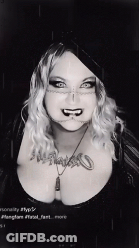 Black And White Photo Of Woman With Fatal Fant Necklace GIF