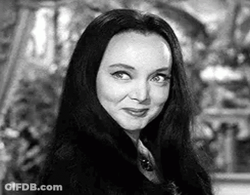 Black And White Photo Of Woman With Long Hair And Necklace GIF