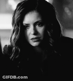 Black And White Photo Of Woman With Long Hair And Serious Look GIF