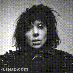 Black And White Photo Of Woman With Messy Hair GIF