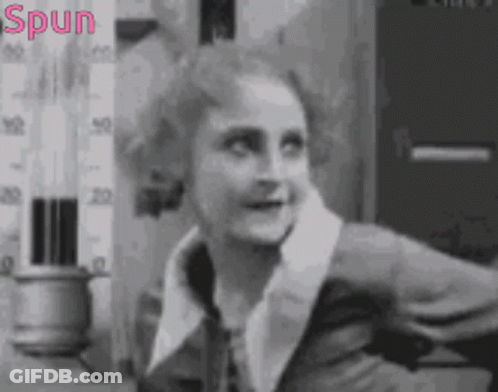 Black And White Photo Of Woman With Spun In Pink GIF