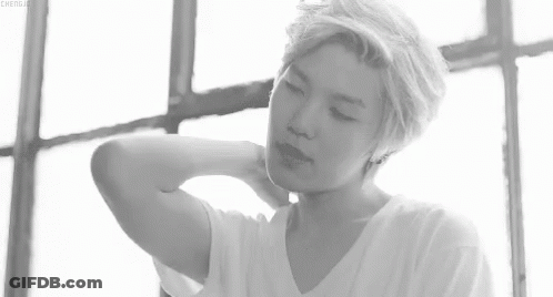 Black And White Photo Of Young Man Hand On Neck GIF