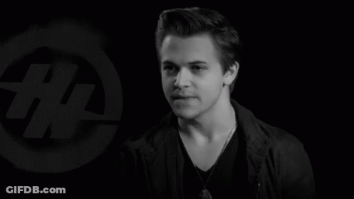 Black And White Photo Of Young Man In Front Of Logo Saying # GIF